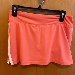 Coral golf/tennis athletic skort with White Stripe